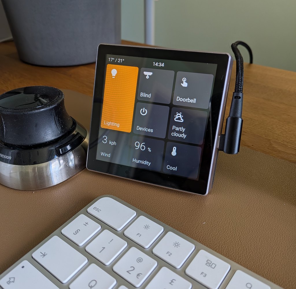 EspControl on the 4-inch 4848S040: square home screen with temperature, clock, and control tiles