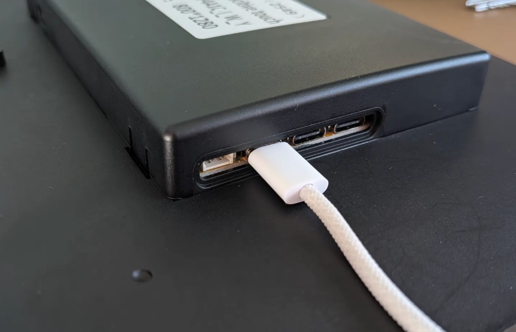 USB-C cable plugged into the bottom USB-C port of the Guition ESP32-P4