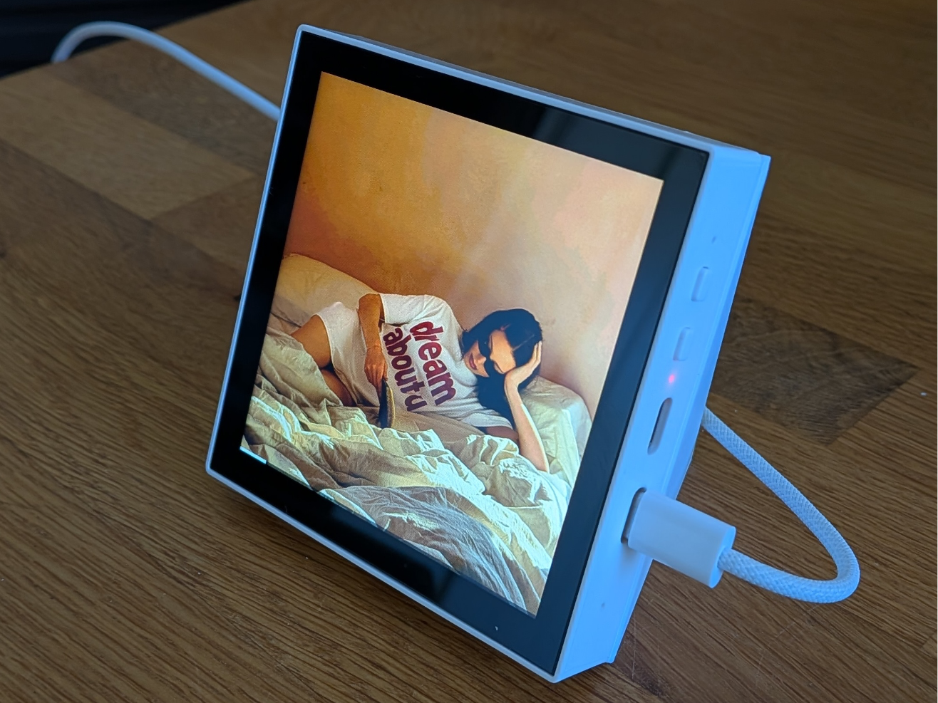 ESP32-P4 86 Panel showing media artwork